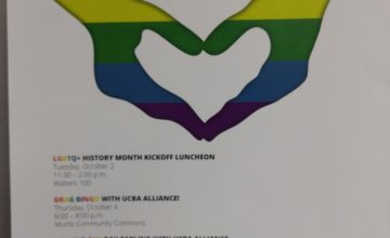 A picture of poster that says LGBTQ+ and includes rainbow-colored hands forming a heart