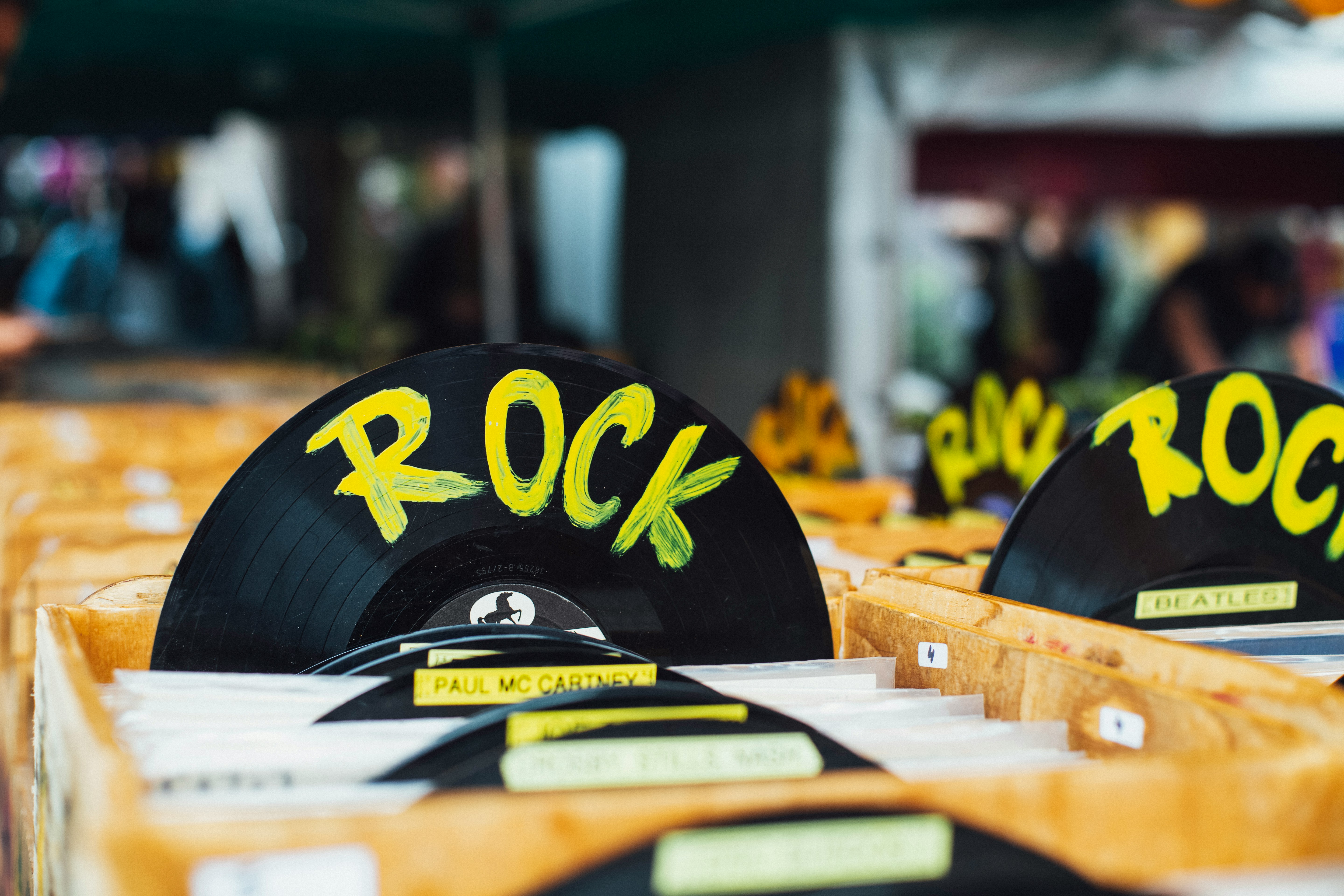 Photo of a box of records, one of which as the word "Rock" written on it. Photo courtesy of Markus Spiske via Unsplash.